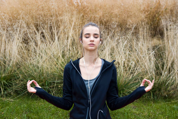 istock Young woman doing yoga in  park 1134435339