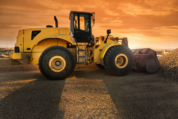 istock Excavator moving gravel in a construction site 1134436074
