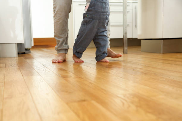 istock Father teaching his boy to walk 1134436898