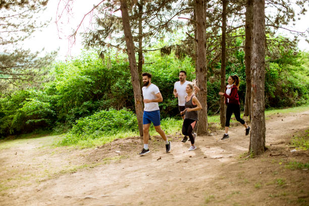 istock Group of young people run a marathon through the forest 1134438384