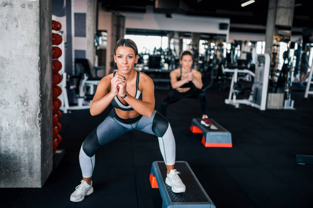 istock Fit women exercising on steppers. 1134438428