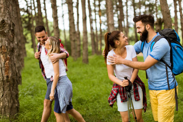 istock Group of four friends hiking together through a forest 1134438441