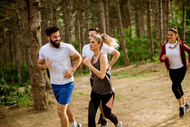 istock Group of young people run a marathon through the forest 1134438446