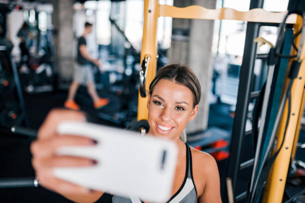 istock Smiling female athlete taking selfie. 1134438465