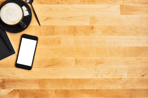 istock Cup of coffee or cappuccino with smartphone 1134440854