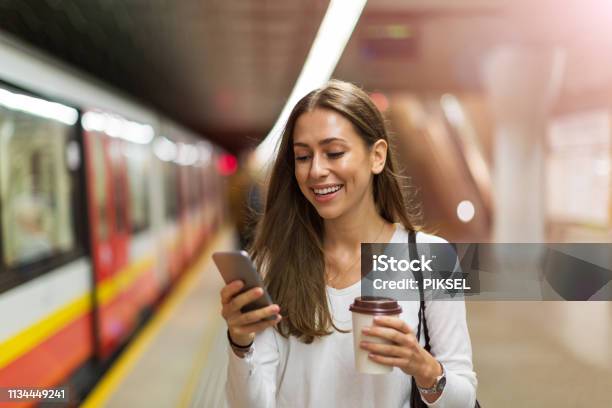 Young Woman At Subway Station Stock Photo - Download Image Now - Women, Mobile Phone, Subway