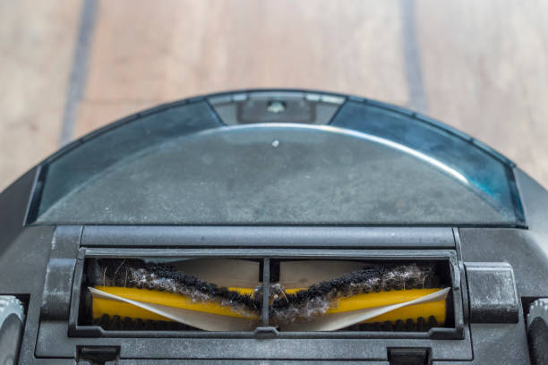 istock Bottom of a robot vacuum cleaner - wheels and brushes 1134449734