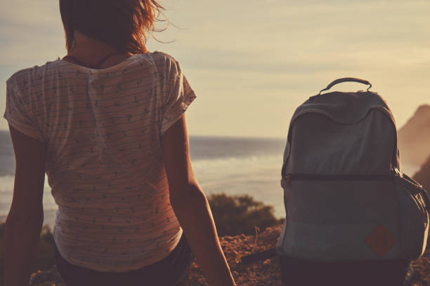 istock Tourist girl with backpack enjoying the view. 1134450842