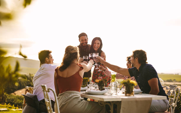 istock Cheerful people celebrating with drinks at party 1134452423