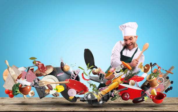 Cheerful chef drumming on pots stock photo