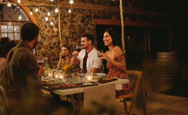 istock Group of friends having wine at dinner party 1134453378