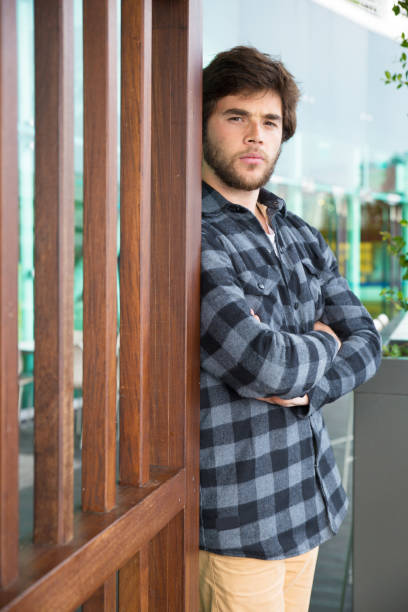 istock Serious handsome man standing outdoors with his arms crossed 1134456801