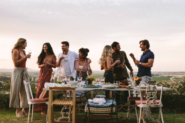 istock Millennials enjoying dinner party outdoors 1134456841