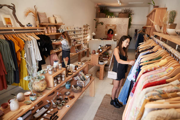 istock Customers Browsing In Independent Clothing And Gift Store 1134458482