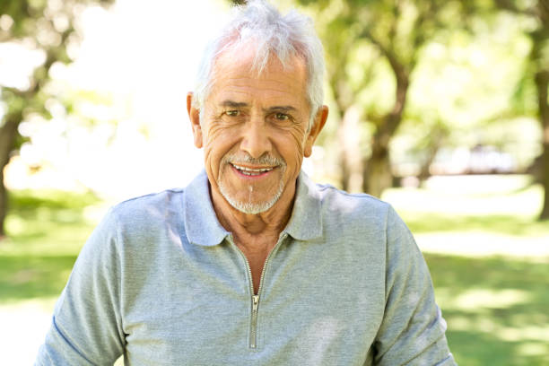 istock Portrait of smiling retired man at back yard 1134458591