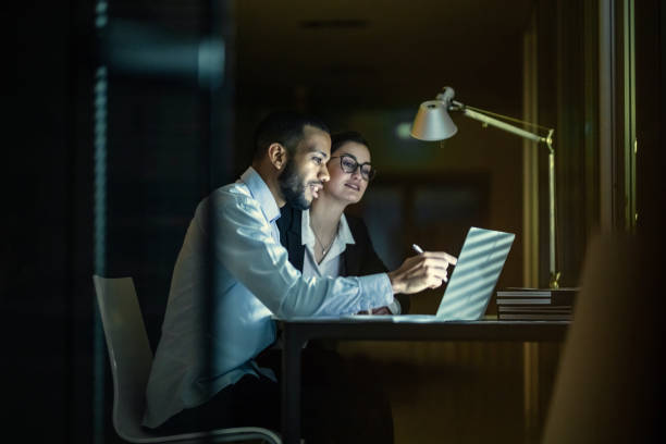 istock Business People Working Late in The Office 1134460145