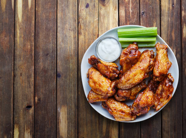istock buffalo chicken wings with ranch and celery in overhead composition 1134464380