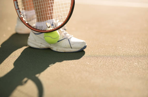 istock Picking up the tennis ball 1134467810