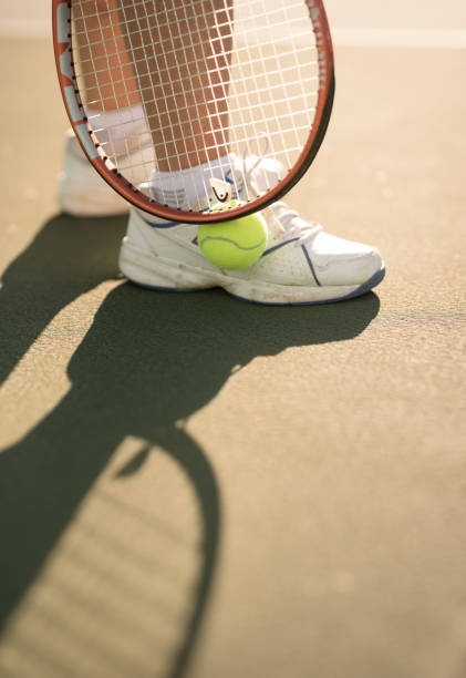 istock Picking up the tennis ball 1134468399