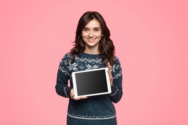 istock Friendly woman demonstrating modern tablet 1134468854