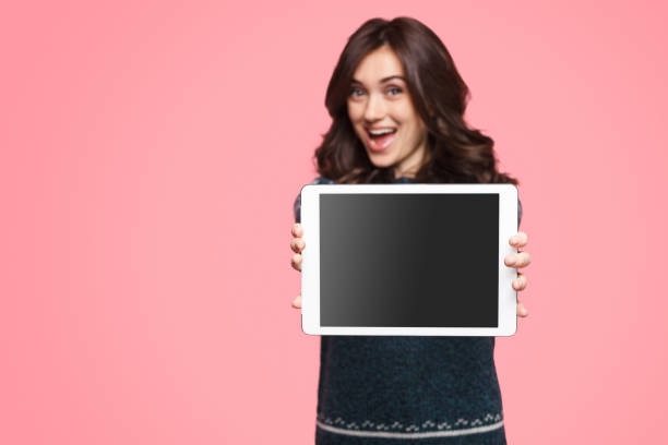 istock Excited female showing tablet to camera 1134468874
