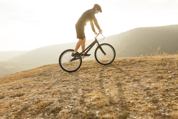 istock Young athlete on bicycle in countryside 1134468876