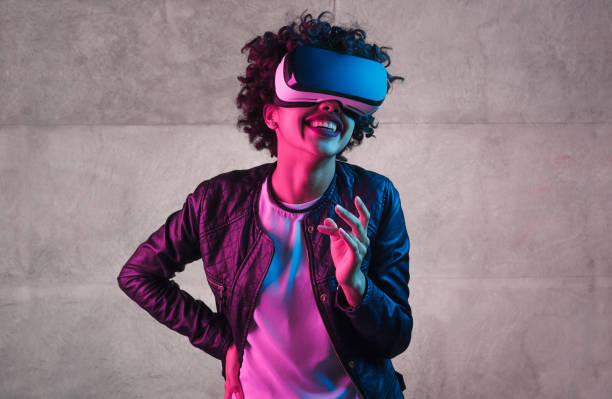 istock Trendy teenager in VR headset laughing 1134468907
