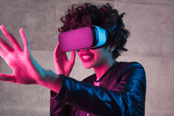 istock Smiling black teenager interacting with virtual reality 1134468911