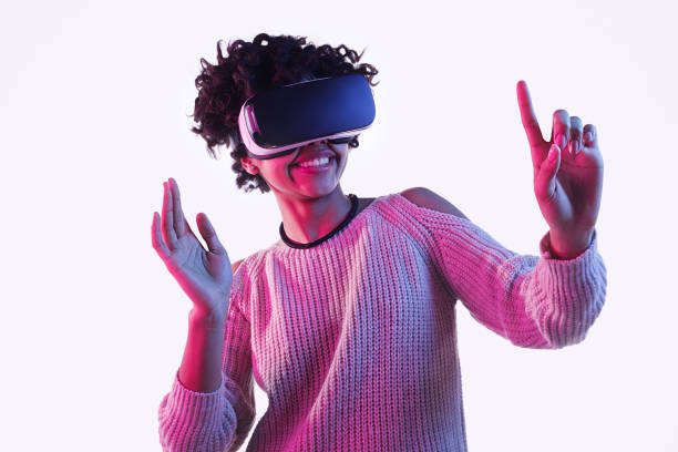 istock Black teenager in VR headset touching invisible screen 1134468919