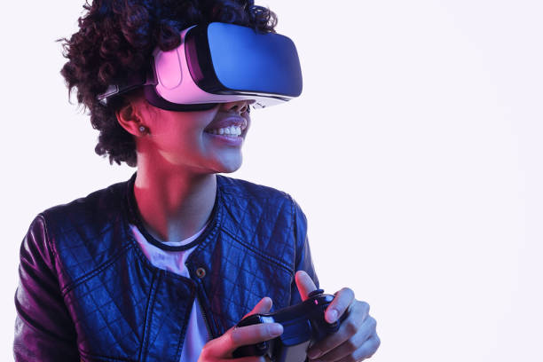istock Cheerful black teenager playing VR game 1134468929