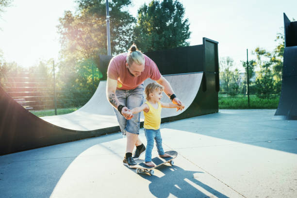istock Modern dad with three year old son in skate park 1134468994