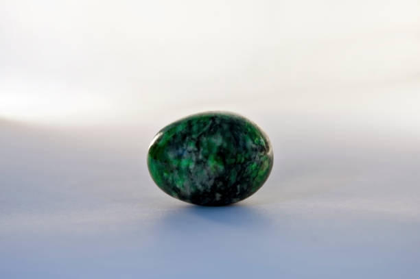 istock The green and black egg rock. 1134470123
