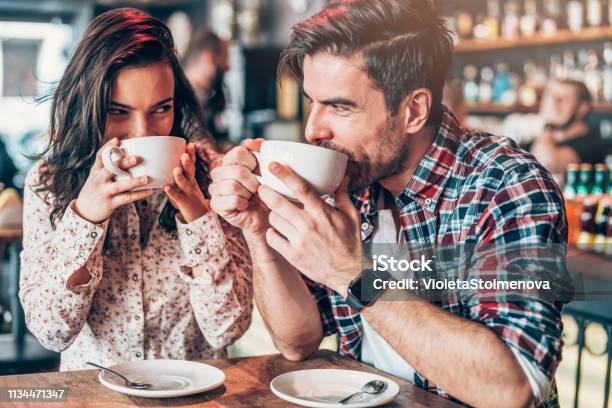 Couple Relaxing In A Cafe Stock Photo - Download Image Now - Coffee - Drink, Dating, Couple - Relationship