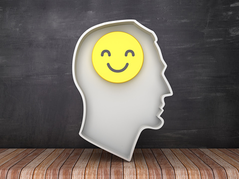 Human Head Shape with Smile Emoticon on Chalkboard Background - 3D Rendering