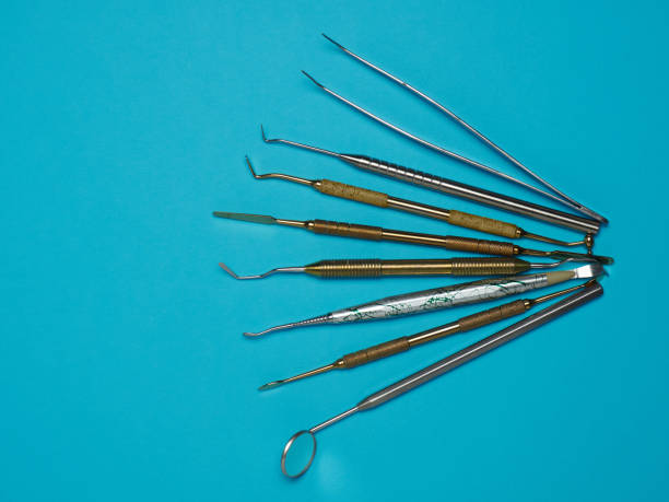 istock Professional dental tools on blue background. Dental health concept 1134473094