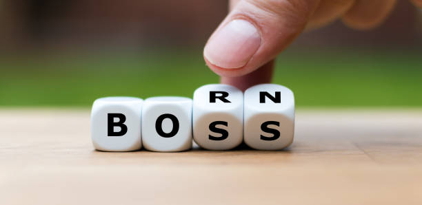 istock Born to be a boss. Hand turns dice and changes the word 