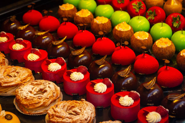 istock Small colorfull cakes with different stuffing on a showcase in shop 1134473551