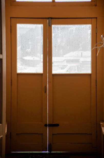 istock Small Wooden Vestibule with Windows on a Cold, Snowy Day 1134477309