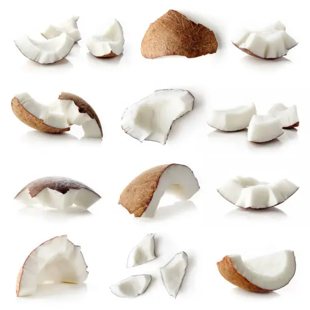 Set of coconut pieces and whole coconut isolated on white background