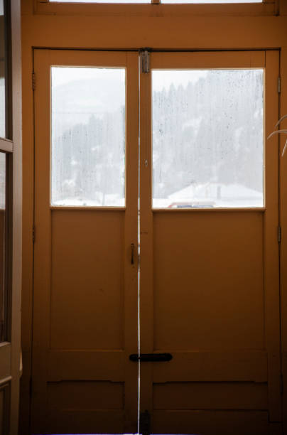 istock Small Wooden Vestibule with Windows on a Cold, Snowy Day 1134477351