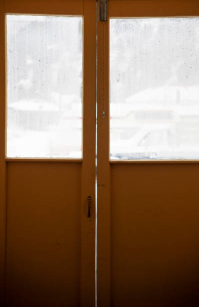 istock Small Wooden Vestibule with Windows on a Cold, Snowy Day 1134477359