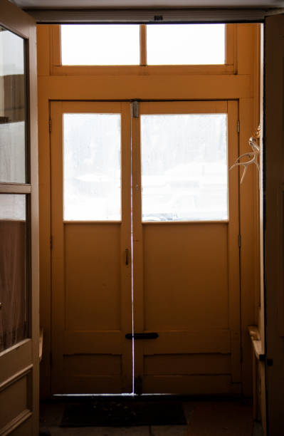 istock Small Wooden Vestibule with Windows on a Snowy, Cold Day 1134477549