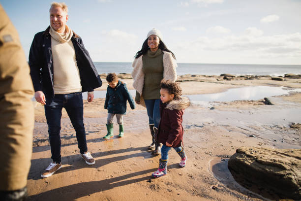 istock Family Exploring The Beach 1134478398