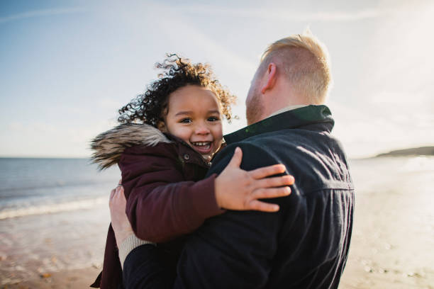 istock Little Girl Embracing Her Father 1134478655
