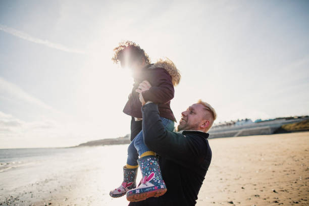 istock Father And Daughter Playing On The Beach 1134478657