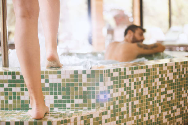 istock Woman entering hot tub barefoot 1134482747