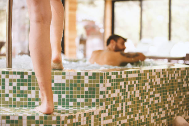 istock Woman entering hot tub barefoot 1134483541