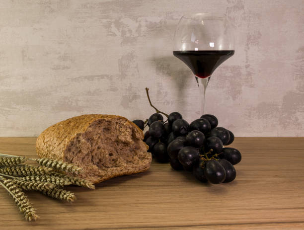 istock A wheat bread and red grapes with wine 1134486774