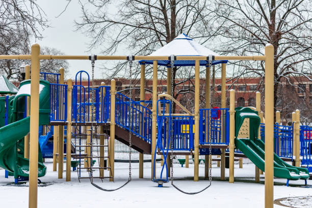 istock Swing Set at a Playground during Winter with Fresh Snow 1134486879