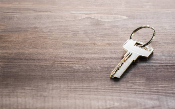 istock Single key on a wooden Board 1134489662